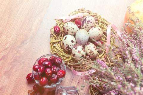 Spring composition, nest with eggs near the bunch of heather, Easter. Stock Photos