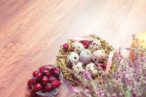 Spring composition, nest with eggs near the bunch of heather, Easter. Stock Photos