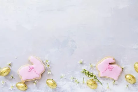 Spring concept. Colorful Easter background with colored eggs and Easter baking. Stock Photos
