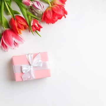 Spring creative holiday present with floral decor Stock Photos