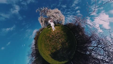 Spring day in a blooming park with joyful movement under sunny skies Stock Footage 308659945