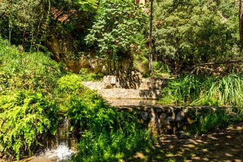 A spring with drinking water, a natural source to quench your thirst on a jou Stock Photos