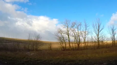 Spring Driving View with Last Snow, Dramatic Blue Skies and Clouds Video stock 36677714