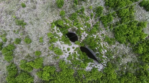 Spring Drone Video of Prohodna Cave God’s Eyes near Karlukovo Bulgaria Stock Footage 323382799