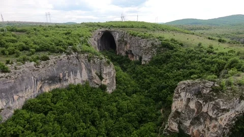 Spring Drone View of Prohodna Cave "God's Eyes" near Karlukovo, BG EU 2019 Stock Footage 323382636