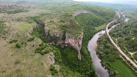 Spring Drone View of Prohodna Cave "God's Eyes" near Karlukovo, EU 2019 Stock Footage 323382815