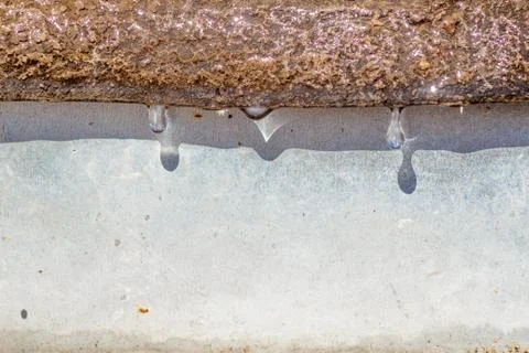 Spring drops on the street in a large macro the increase of the sun Stock Photos