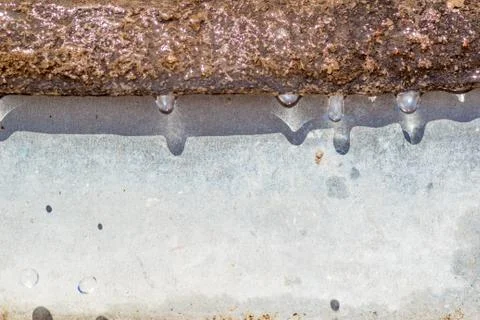 Spring drops on the street in a large macro the increase of the sun Stock Photos