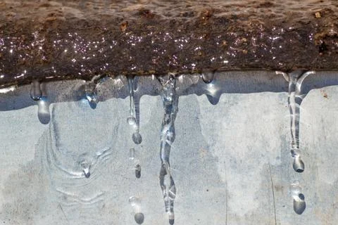 Spring drops on the street in a large macro the increase of the sun Stock Photos