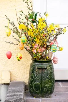 Spring Easter Bouquet with Painted Eggs in Green Ceramic Pot Stock Photos