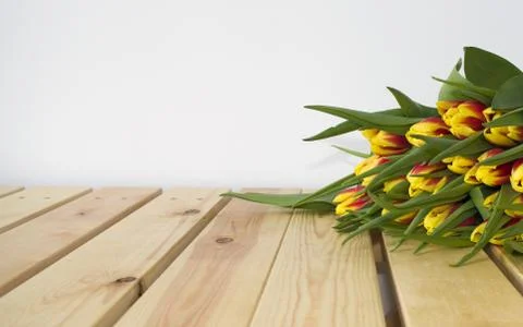 Spring Easter bouquet of tulip flowers on wooden background. Stock Photos