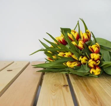 Spring Easter bouquet of tulip flowers on wooden background. Stock Photos