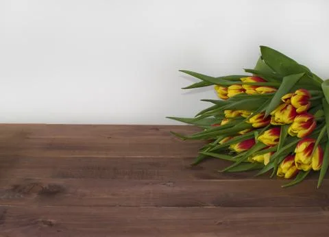 Spring Easter bouquet of tulip flowers on wooden background. Stock Photos