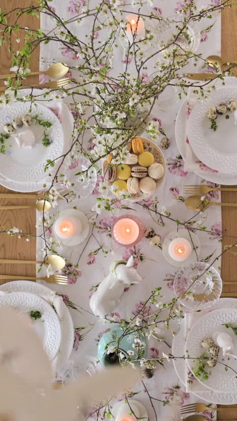 Spring Easter decor. Easter table setting. Flowers and dishes and candles for a Stock Footage 270243289