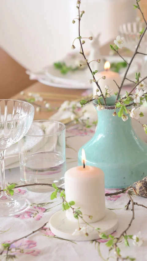 Spring Easter decor. Easter table setting. Flowers and dishes and candles for a Stock Footage 270243477
