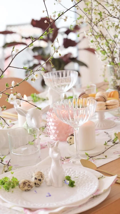 Spring Easter decor. Easter table setting. Flowers and dishes and candles for a Video stock 270243593