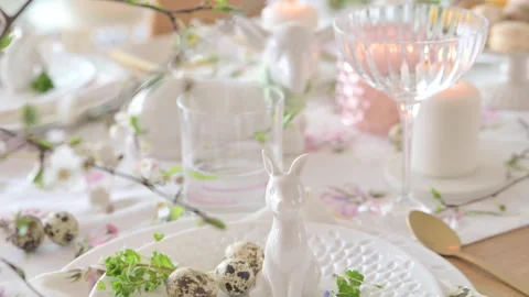 Spring Easter decor. Easter table setting. Flowers and dishes and candles for a Stock Footage 270244009