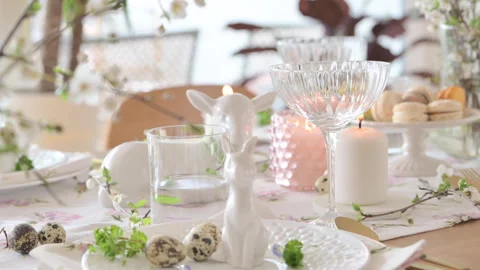 Spring Easter decor. Easter table setting. Flowers and dishes and candles for a Video stock 270244146