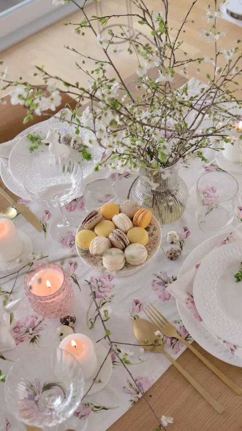 Spring Easter decor. Easter table setting. Flowers and dishes and candles for a Video stock 272817453