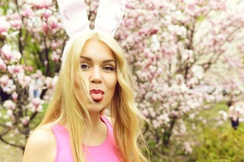 Spring, easter holidays celebration, Happy woman in bunny ears Stock Photos