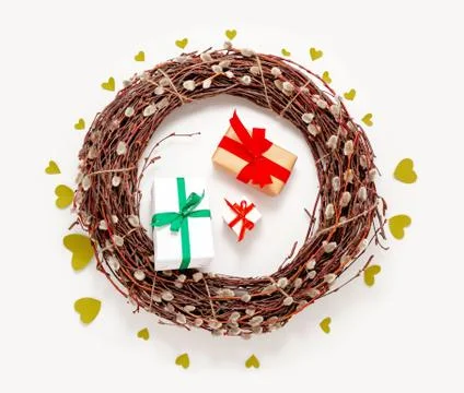Spring Easter wreath, willow tree branches, present gift boxes and green hear Stock Photos