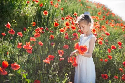 Spring environment concept of small thin girl wearing white summer dress with Foto stock