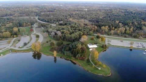 Spring to Fall Still Lake Peninsula With Forest in Background Stock-Footage 129773205