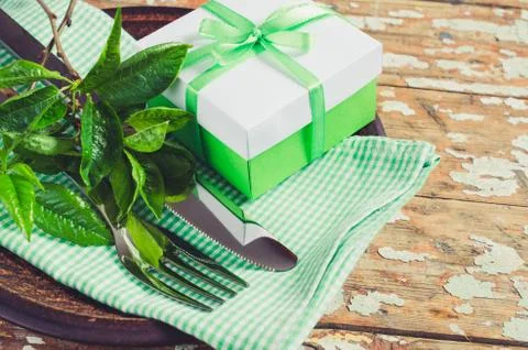 Spring Festive Table Setting with Present. Stock Photos