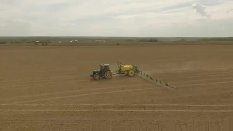 Spring field with a tractor Round shot Tractor turns right Stock Footage 69125145