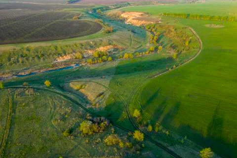 Spring fields, meadows, ravines at sunset from the quadrocopter Stock Photos