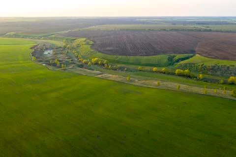 Spring fields, meadows, ravines at sunset from the quadrocopter Stock Photos