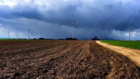 Spring fields with windmills under cloudy sky. Polish spring landscape Stock Footage 237254392