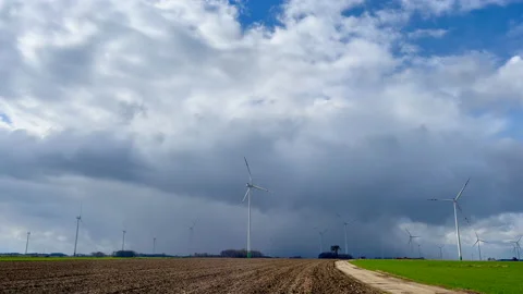 Spring fields with windmills under cloudy sky. Polish spring landscape Stock Footage 237254423
