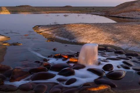 Spring of fire water. Burning methane in water. Cold fire Stock-Fotos