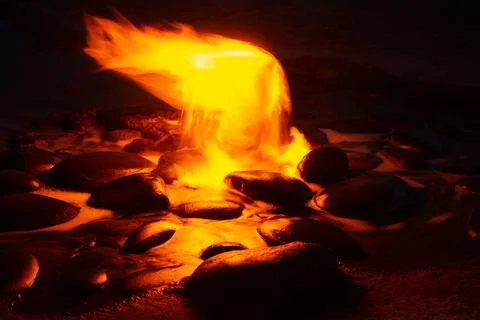 Spring of fire water. Burning methane in water. Cold fire Stock Photos