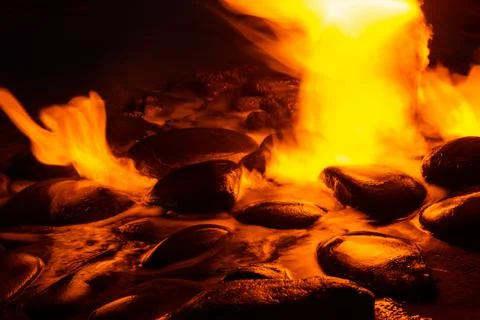Spring of fire water. Burning methane in water. Cold fire Stock Photos