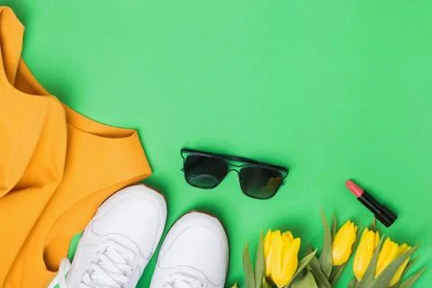Spring flat lay composition with feminine accessories and yellow tulips Stock Photos