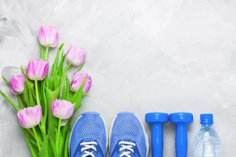 Spring flatlay composition with sport equipment and tulips. Stock Photos