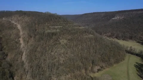Spring flight through valley towards ruins of Cabrad castle, central Slovakia Stock Footage 137387928