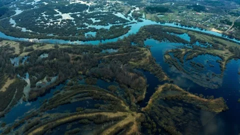 Spring flood, overflow of a large river from a bird's eye view. Full-flowing Stock Footage 153630491