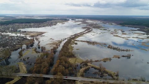 Spring flood on the river. Bridge, road, cars, countryside. Spring. Video stock 151685881