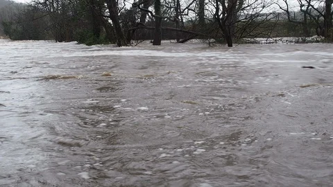 Spring Flooding And Fast Moving River Stock Footage 91864959