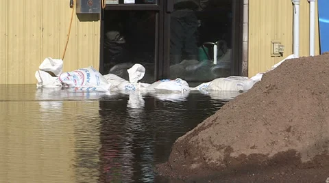 Spring flooding and rushing water after long cold snowy winter Stock Footage 39351659
