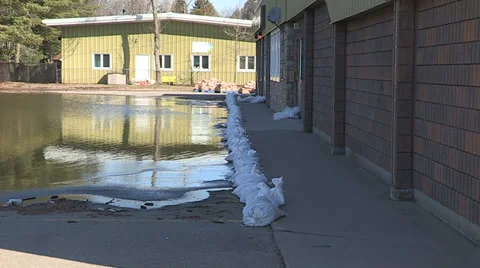 Spring flooding and rushing water after long cold snowy winter Stock Footage 39352715