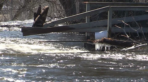 Spring flooding and rushing water after long cold snowy winter Stock Footage 39356003