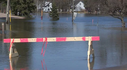 Spring flooding and rushing water after long cold snowy winter Stock Footage 39357689