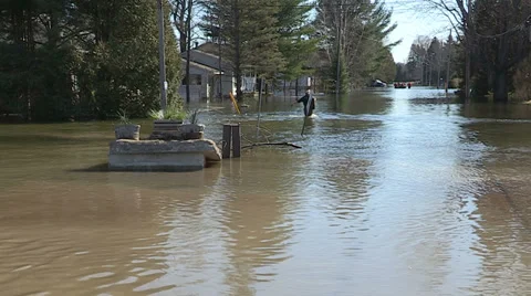 Spring flooding and rushing water after long cold snowy winter Stock Footage 39363588