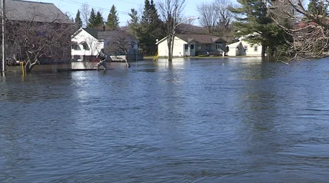 Spring flooding and rushing water after long cold snowy winter Stock Footage 39365738