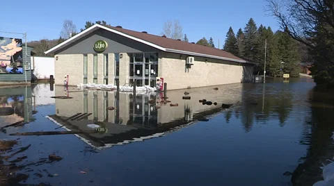 Spring flooding and rushing water after long cold snowy winter Stock Footage 39367456