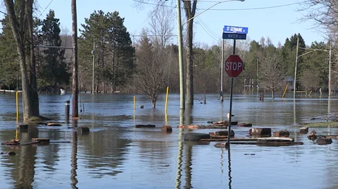 Spring flooding and rushing water after long cold snowy winter Stock Footage 39368211